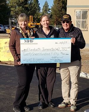 Ginny and Dave Hanna stand with Elizabeth Jorannstad, after presenting her with the bonus award from the Violet B. Hanna Memorial Scholarship fund.