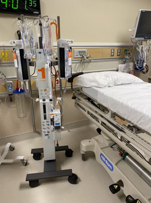 This is a picture of a hospital bed in what looks like a hospital er room.